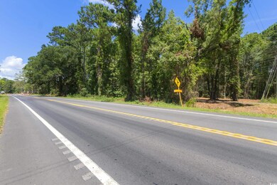View of asphalt street with traffic signs