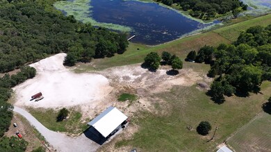 Aerial View of Shop, house pad and Pond