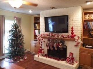 Great room with wood burning fireplace, built in s