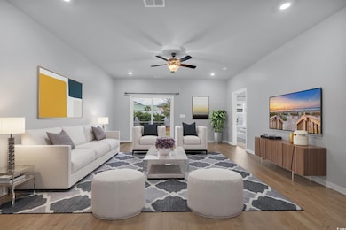 Living area featuring recessed lighting, wood fini