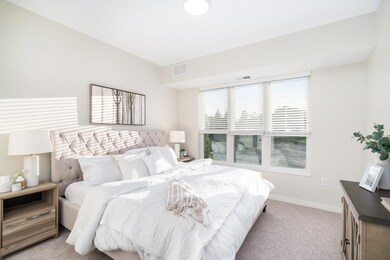 The spacious primary bedroom is a sanctuary of comfort.