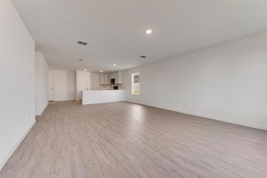 Unfurnished living room with light wood-type floor