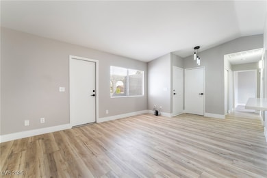 Unfurnished living room with light wood finished f