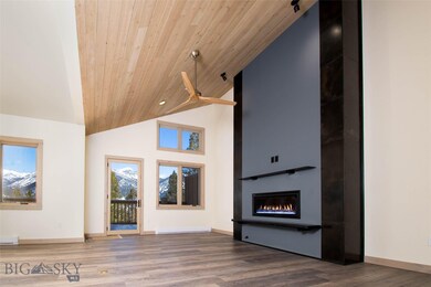 Main Level Living Room with gas fireplace and deck