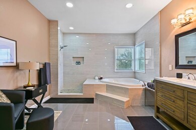 Marble throughout this HUGE Master Bathroom!