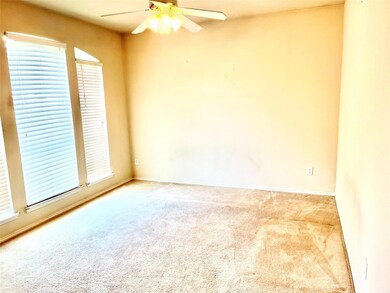Unfurnished room with ceiling fan and carpet floor