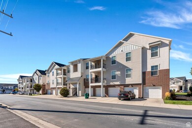 View of asphalt road featuring sidewalks, curbs, and a residential view