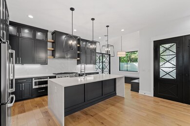 Kitchen with decorative backsplash, light counter