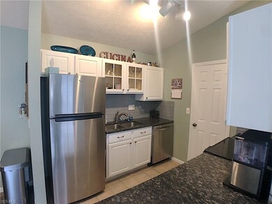 Updated kitchen has stainless steel appliances.