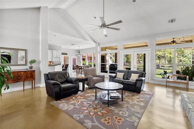 Living area featuring french doors, finished conc