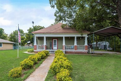 This is an inviting front porch where you can sit and talk to your friends and family on the swing with your favorite lemonade!
