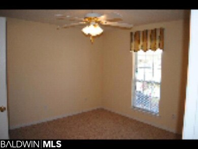 Bedroom 2 has a ceiling fan, carpet on floors, blinds and valance.