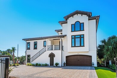Mediterranean / spanish home featuring a garage