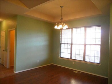 Exterior Front. Spacious formal dining room is open to living room with service access directly to kitchen.