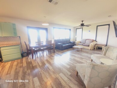Living area featuring light wood-type flooring an