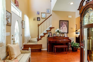 Entrance foyer featuring wood-type flooring