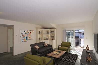 Spacious living room w/built ins