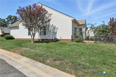 View of side of property with roof with shingles
