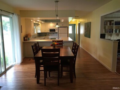 Open into kitchen
