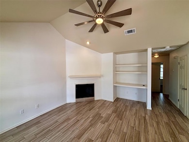 Unfurnished living room with wood finished floors