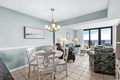 Dining area featuring a notable chandelier and lig
