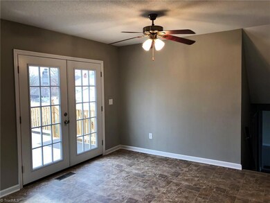 Bright dinning room with french door leading to brand new deck!