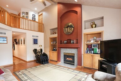Living area with open loft upstairs