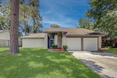 This photo shows a single-story house with a two-c