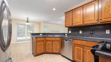 Kitchen w view of breakfast bar