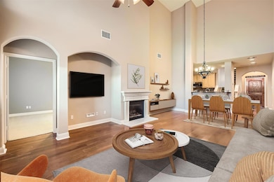 Living room with a chandelier, wood finished floo