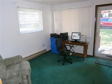 A CORNER WINDOW IN THE LIVINGROOM PROVIDES EXCEPTI