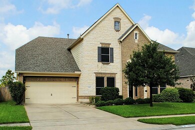 Large 3 car tandem garage with attic storage space above.