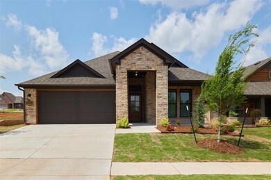 View of front facade with a garage and a front yar