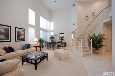 SPACIOUS LIVING & DINING ROOM W/2 STORY CEILINGS