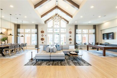 Living room featuring beam ceiling, hardwood / woo