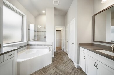 **Home is Under Construction. The photo shown here is of a completed home that has the same floor plan and similar elevation. Options and color selections may vary.**