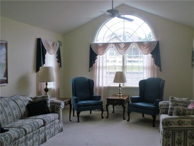 Cathedral ceiling and fan in the Living Room.