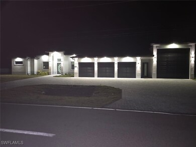 View of front of home with driveway, stucco siding