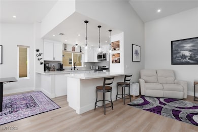 This stylish kitchen opens to the living area, com