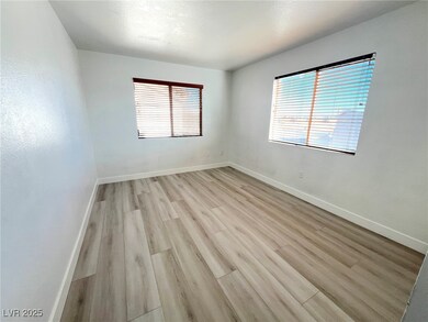 Unfurnished room with light wood-style floors, bas