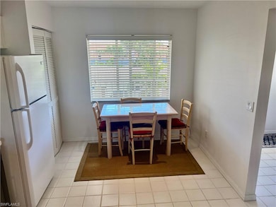Dining area featuring tile patterned floors and ba