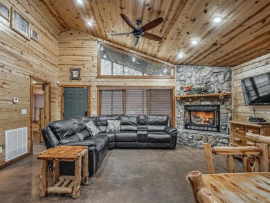 Living room with lofted ceiling, a fireplace, ceil