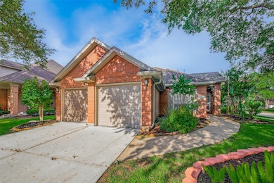 Brick elevation, Village Builder home with lush la