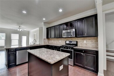 Kitchen with stainless steel appliances, a sink, o