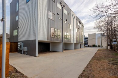 View of building exterior featuring fence