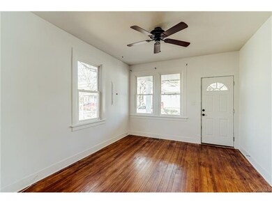Spacious sunny living room with hard woods, 3 big 