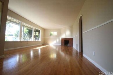 Refinished hardwood floors, fireplace and three bi