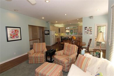 VIEW THROUGH HEARTH ROOM TO KITCHEN.  SCREENED IN 