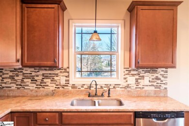 Wash dishes overlooking the side yard and distant 