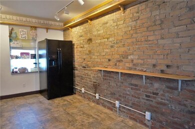 Bonus room with exposed brick!  This room could be